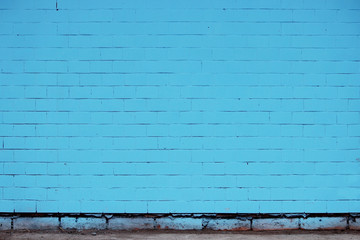 The Brick wall painted in blue.