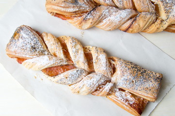Braided sweet puff pastry with poppy seeds