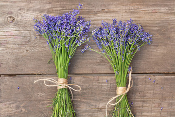 Bouquets of lavender on vintage wood background