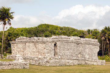 Fototapeta na wymiar Remnants of the ancient Mayan building in the Tulum Archaeological Zone in Quintana Roo, Mexico