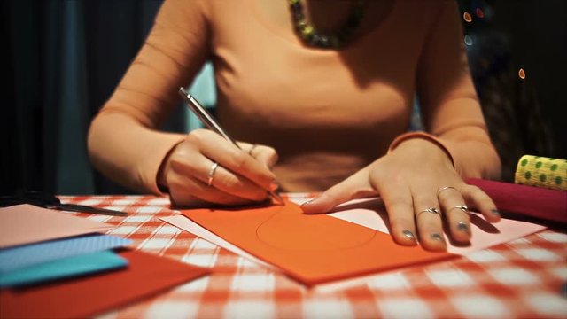 Female drawing heart shape for making valentine card hd