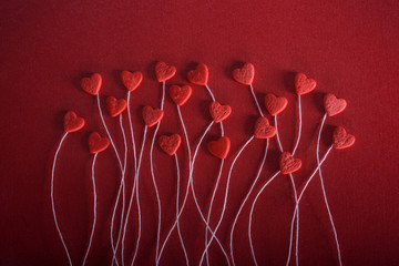 Romantic hearts on a red background. The concept for Valentine's day. Decorative card