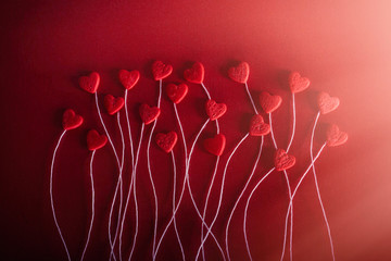 Romantic hearts on a red background. The concept for Valentine's day. Decorative card