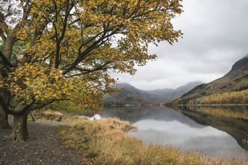 Beautiful Autumn Fall landscape image of Lake Buttermere in Lake