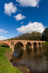 Fototapeta premium Bredwardine Bridge, red brick crossing river Wye