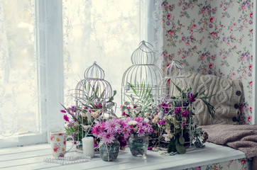 Pink and purple flowers near the window