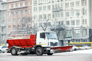 Snow plow truck outdoors cleaning street