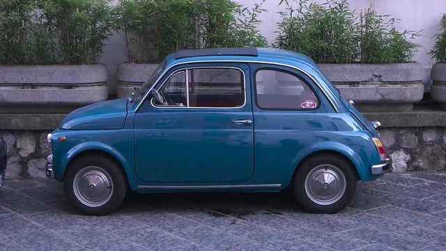 a blue small vintage car.