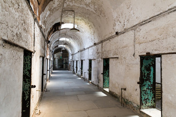 Fototapeta na wymiar Old prison interior with brick walls