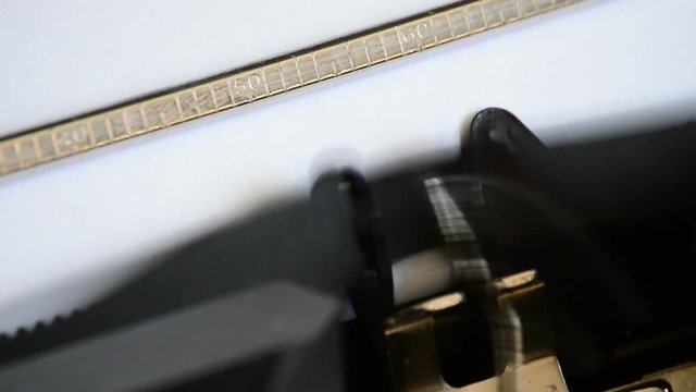Typing the expression Final Chapter with an old manual typewriter