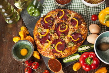 Delicious pizza served on wooden table