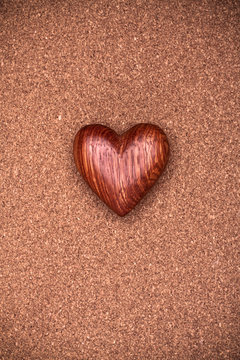 One wooden heart on rustic wood background. Valentines days conc