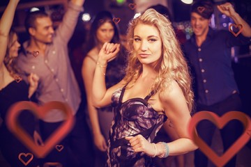 Naklejka premium Composite image of cute friends having fun and dancing