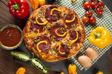 Delicious pizza served on wooden table