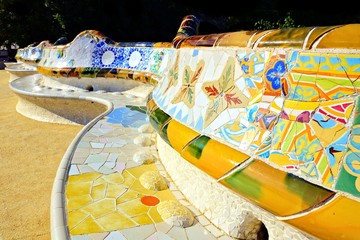 Colorful curving mosaic walls of Parc Guell, Barcelona, Spain - obrazy, fototapety, plakaty