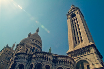 Lens flare over Sacre Coeur basilica in Paris, France