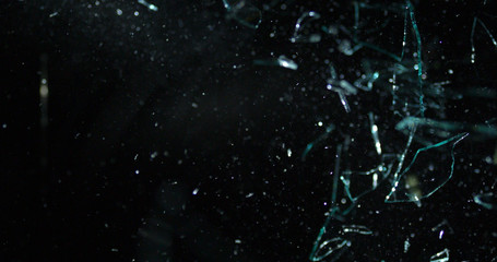 Debris flying everywhere from shattered glass in space