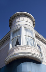 Fototapeta na wymiar San Francisco Victorian bay window against blue sky