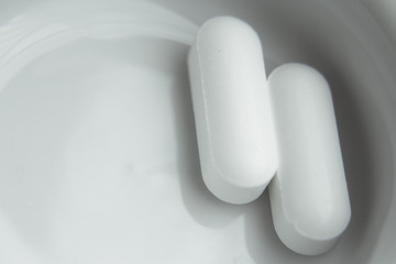 White pills for muscle aches