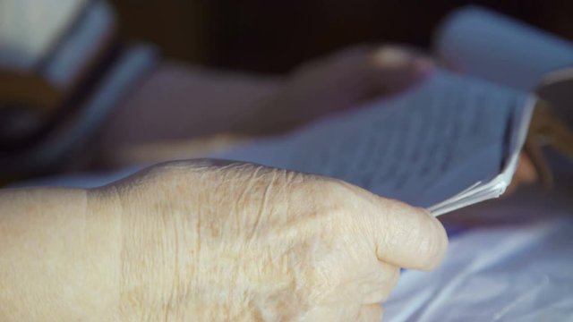 Hands of old woman who keeps covenant