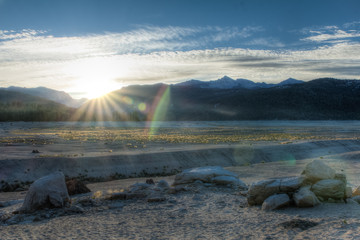 Sunrise over the empty basin of a dried up lake in the high sierra