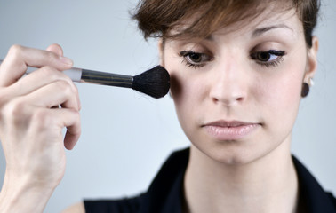 Woman proceed a beauty make-up
