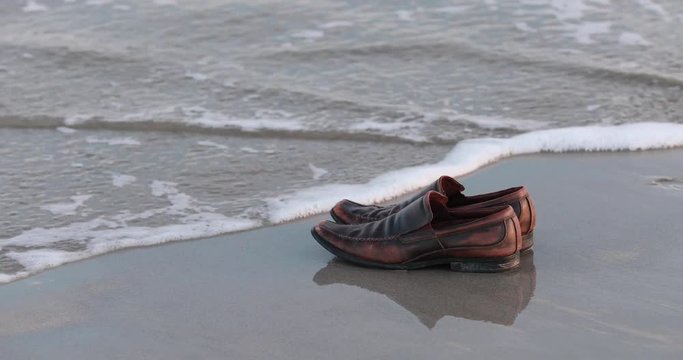 Dress Shoes by the Ocean - Swept away by waves