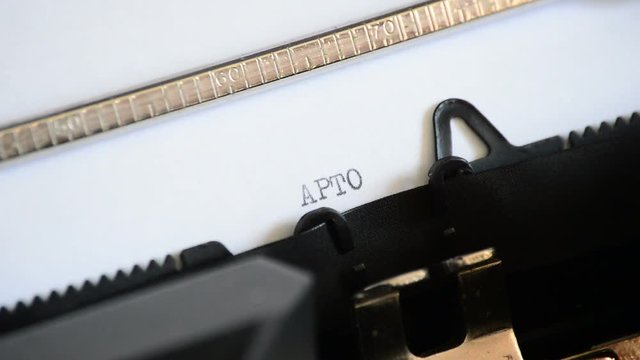 Typing the word in spanish Apto with an old manual typewriter