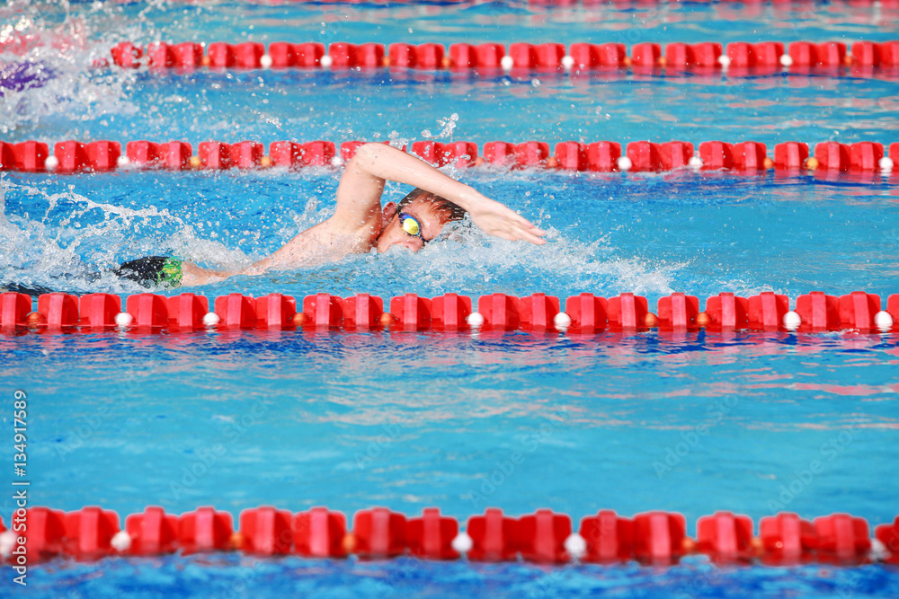 Wall mural motion blurred freestyle swimmer