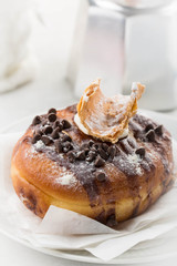 Cannoli donut on a white plate 