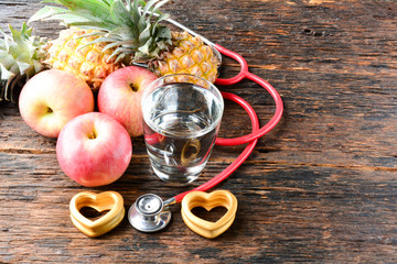 Fruit, heart, stethoscope and water glass for healthy and body slim 