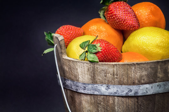 fruit gathered in a rustic wooden bucket