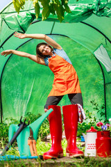Female farmer and gardening tools in garden