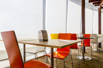 Tables and chairs in restaurant