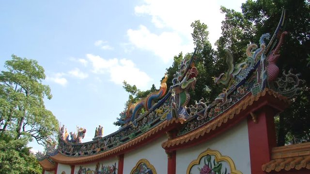 Airplane MD-80 arrives n Taipei, Taiwan with a typical Chinese wall at the foreground