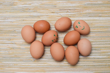 Chicken eggs in the straw tablecloth background