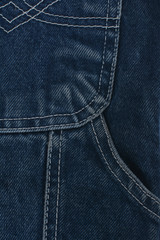 Texture denim. Dense tissue. Textiles. Background. Dark blue natural fabric.