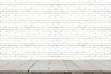Wooden floor with old brick wall for background.