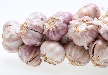 String of garlic isolated on white background