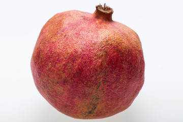Fototapeta na wymiar red pomegranate isolated on a white background