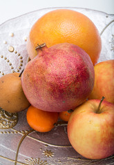 mix fresh fruits on plate isolated on white