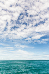 Obraz premium blue sky with cloud over the sea background,