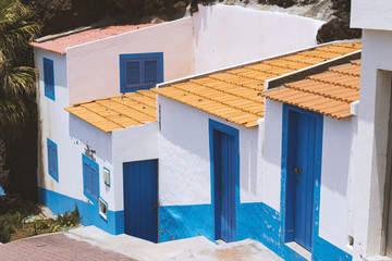 Fototapeta na wymiar common and simple design of white and blue house in Madeira island, Portugal