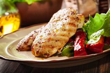 Grilled chicken breasts served with grilled paprika