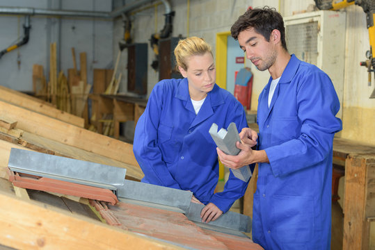 workers in carpentry workshop
