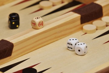 Cubes and game pieces on a backgammon board