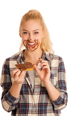 Young blond woman eating breakfast bread and nougat spread isola