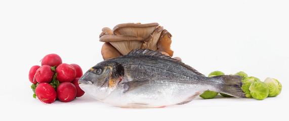 dorado fish, radishes, eggs, spices and brussels sprouts isolated on white background