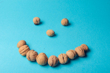 Fototapeta na wymiar Walnuts, walnuts close-up, walnuts on blue background,