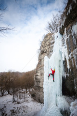 The climber climbs on ice.